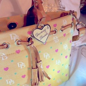Dooney & Bourke yellow signature canvas purse with heart details